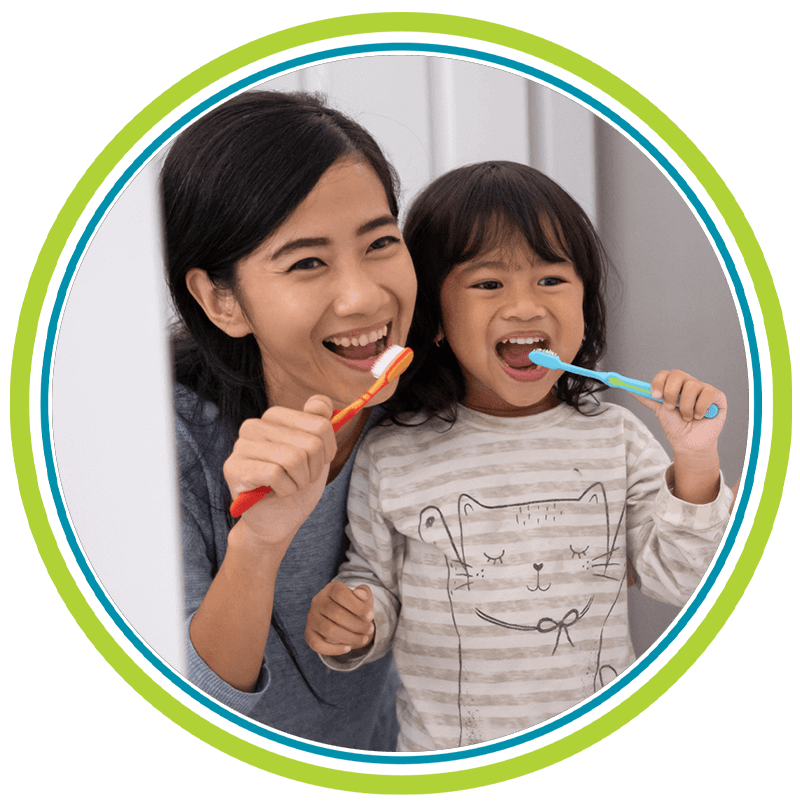 girl brushing with her mom