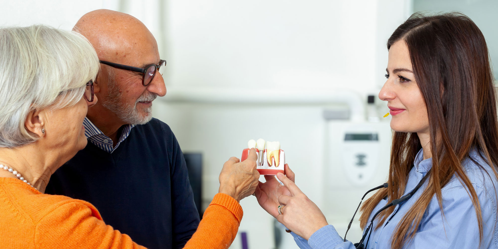 people learning more about the cost of dental implants