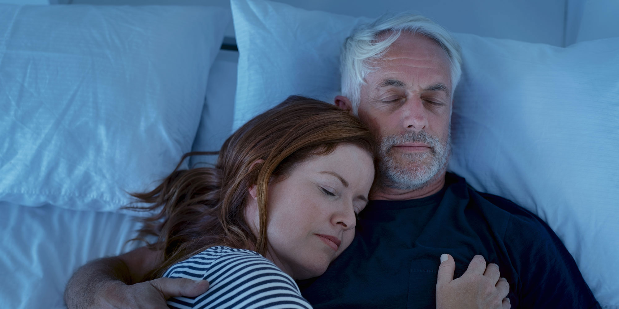 man sleeping better with wife