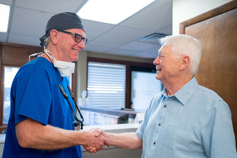 dr with man during consult