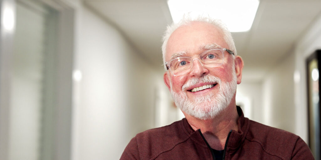 man with his new smile and glasses